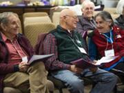 Richard Sauter, left, Les Burger and his wife Julie Burger chat during a Sing Here Now choir practice at Mannahouse Church in Vancouver. Sing Here Now is Clark County&#039;s only Alzheimer&#039;s Choir. It&#039;s run by the Alzheimer&#039;s Association Oregon &amp; Southwest Washington Chapter.