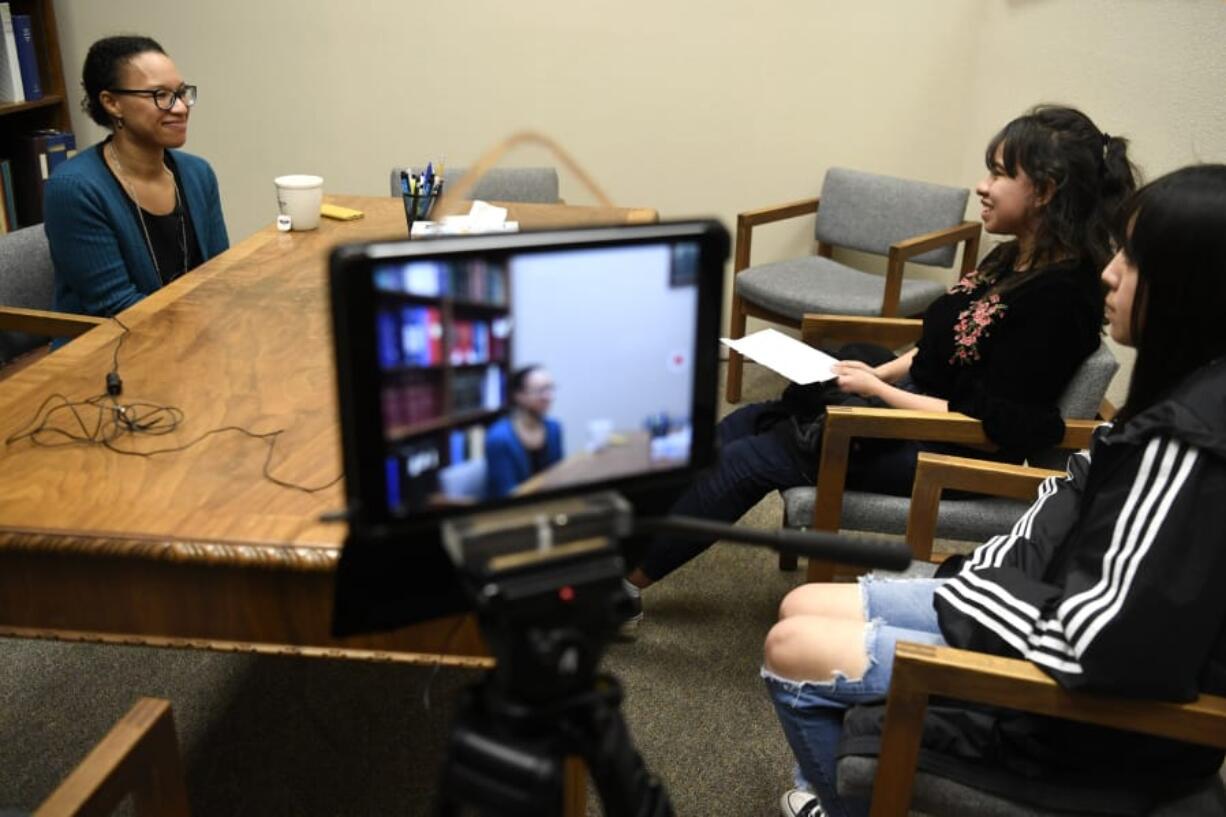 Immigration attorney Mercedes Riggs, from left, answers interview questions from Fort Vancouver High School Center for International Studies juniors Fabiola Rico and Rocio Marin at her office in Vancouver in late January. Fabiola and Rocio produced short documentaries about racism and immigration for their history class, where teacher Jonathan Schnacky encourages his students to pursue projects they&#039;re personally interested in.