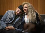 Lennes Flores, left, cries while hugging his mother, Enedis Flores, after watching a documentary that tells their family&#039;s story during The Columbian&#039;s &quot;Bridging the Border&quot; forum at the Vancouver Community Library on Thursday.