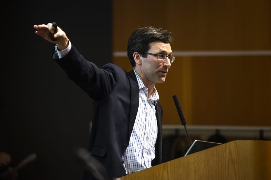 Washington State Attorney General Bob Ferguson speaks about the state&#039;s lawsuit against Motel 6 for their practice of sharing guest&#039;s names with U.S. Immigration and Customs Enforcement during The Columbian&#039;s &quot;Bridging the Border&quot; forum at the Vancouver Community Library on Thursday.