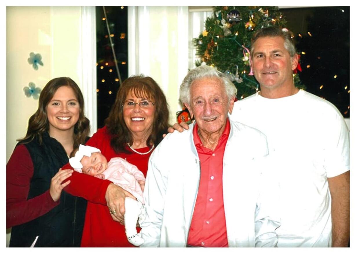 Paisley DeKalb, one month, is held by her great-grandmother, Pat Crawford, 71, at a holiday gathering at her home in the Image neighborhood, Vancouver.