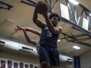 King’s Way’s Kobi Cason completes a layup against La Center at La Center High School on Thursday night, Feb. 6, 2020.