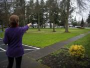 The Rev. JoAnn Schaadt-Shipley of Vancouver Heights United Methodist Church points to the area on the grounds where the church is hoping to build a walking labyrinth.