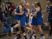 Kelso celebrates their win over Hudson’s Bay during a game at Mountain View High School on Friday night, Feb. 7, 2020.