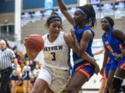 Skyview’s Mikelle Anthony drives to the hoop against Auburn during a game at Skyview High School on Thursday night, Feb. 13, 2020.