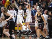 The Prairie bench reacts to a three during a game against Yelm at Prairie High School on Friday night, Feb. 14, 2020.