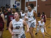 Hudson’s Bay players celebrate their victory over Prairie High School in the 3A district semifinals at Columbia River High School on Feb. 19, 2020. The Hudson’s Bay Eagles defeated the Prairie Falcons 46-45.