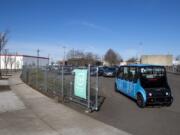 One of the five RYD cars travels into a shared parking lot off Jefferson Street in Vancouver. RYD partners with multiple businesses throughout downtown Vancouver to provide rides for their employees to and from designated parking lots.