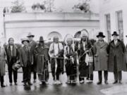 Frank Iyall, third from right, stands with President Calvin Coolidge, far right, in the 1920s. Iyall lobbied the federal government for Native American rights and recognition, a fight his descendants continued.