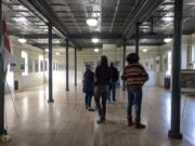 People attend The Historic Trust&#039;s educational Winter Chautauqua event, &quot;Black Roots in the Lower Columbia River Basin,&quot; on Saturday at Fort Vancouver&#039;s Artillery Barracks.