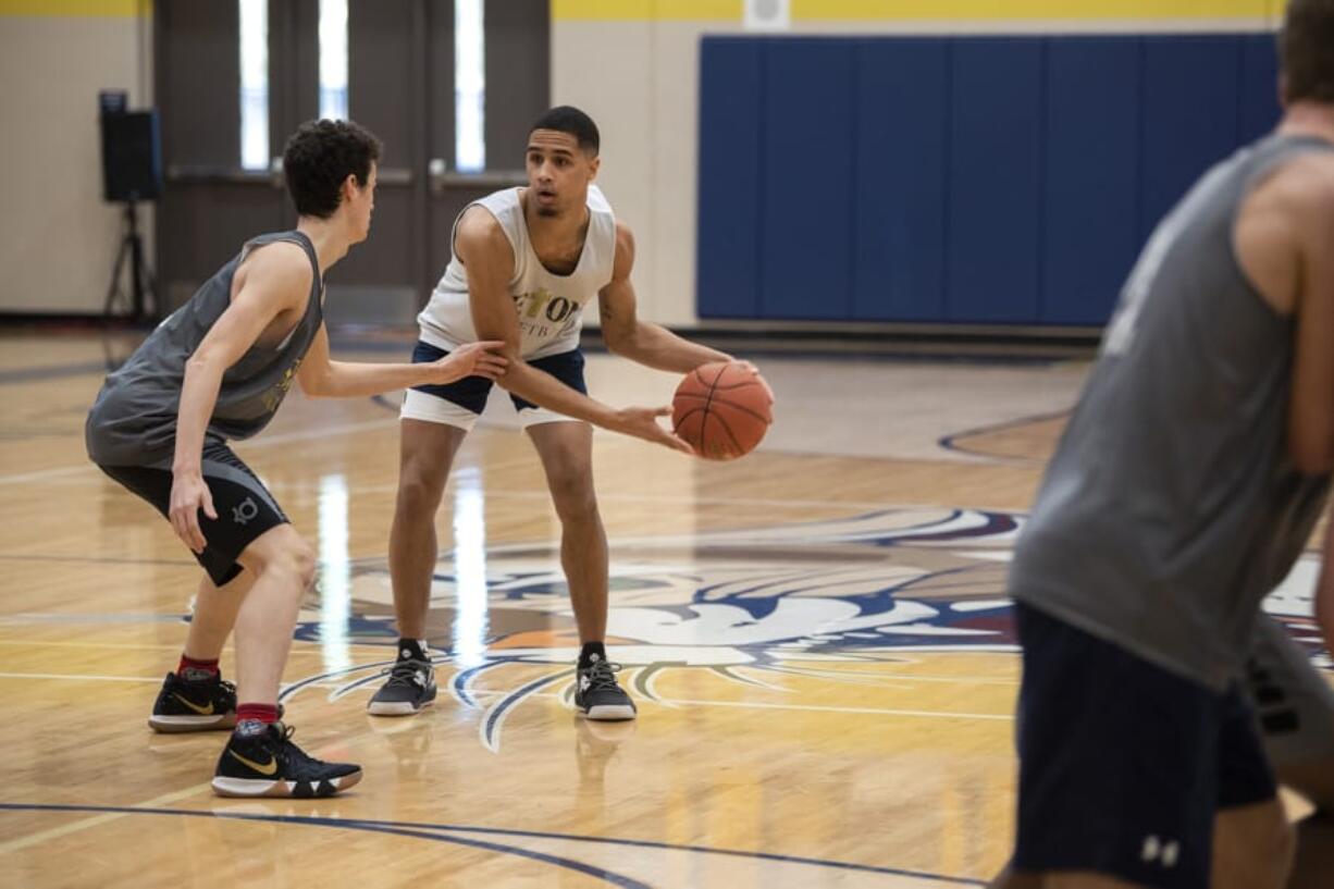 Seton Catholic senior all-league player Xavian Rushing, center, runs through drills with his teammates during practice in Vancouver on Feb. 26, 2020.