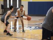 Seton Catholic senior all-league player Xavian Rushing, center, runs through drills with his teammates during practice in Vancouver on Feb. 26, 2020.