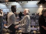 Evan Kamme, left, president of the Associated Students of Clark College, greets Sandra Fowler-Hill, interim president of Clark College, following the 2020 State of the College address at Clark College on Wednesday. Fowler-Hill&#039;s speech reflected on the challenges of the last year while looking forward with optimism at the future of the college.