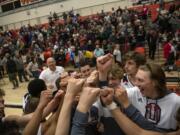 The Union Titans celebrate their victory over the Gonzaga Prep Bullpups at Battle Ground High School on Saturday evening, Feb. 29, 2020.