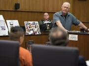 Jerry Romano, facing, father of murder victim Ariel Romano, speaks directly to defendant Jonathan &quot;Jon Jon&quot; Oson, in orange, while giving his victim impact statement before sentencing Thursday in Clark County Superior Court.