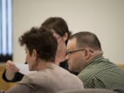 Ryan M. Burge, right, who stands accused of killing his then-girlfriend's 5-year-old daughter, Hartley Anderson, listens to opening statements in his trial in Clark County Superior Court on Tuesday afternoon, Feb. 4, 2020.