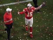 Kansas City Chiefs quarterback Patrick Mahomes (15) raises his arms after his team won the NFL Super Bowl 54 football game against the San Francisco 49ers, Sunday, Feb. 2, 2020, in Miami Gardens, Fla. The Chiefs' defeated the 49ers 31-20.