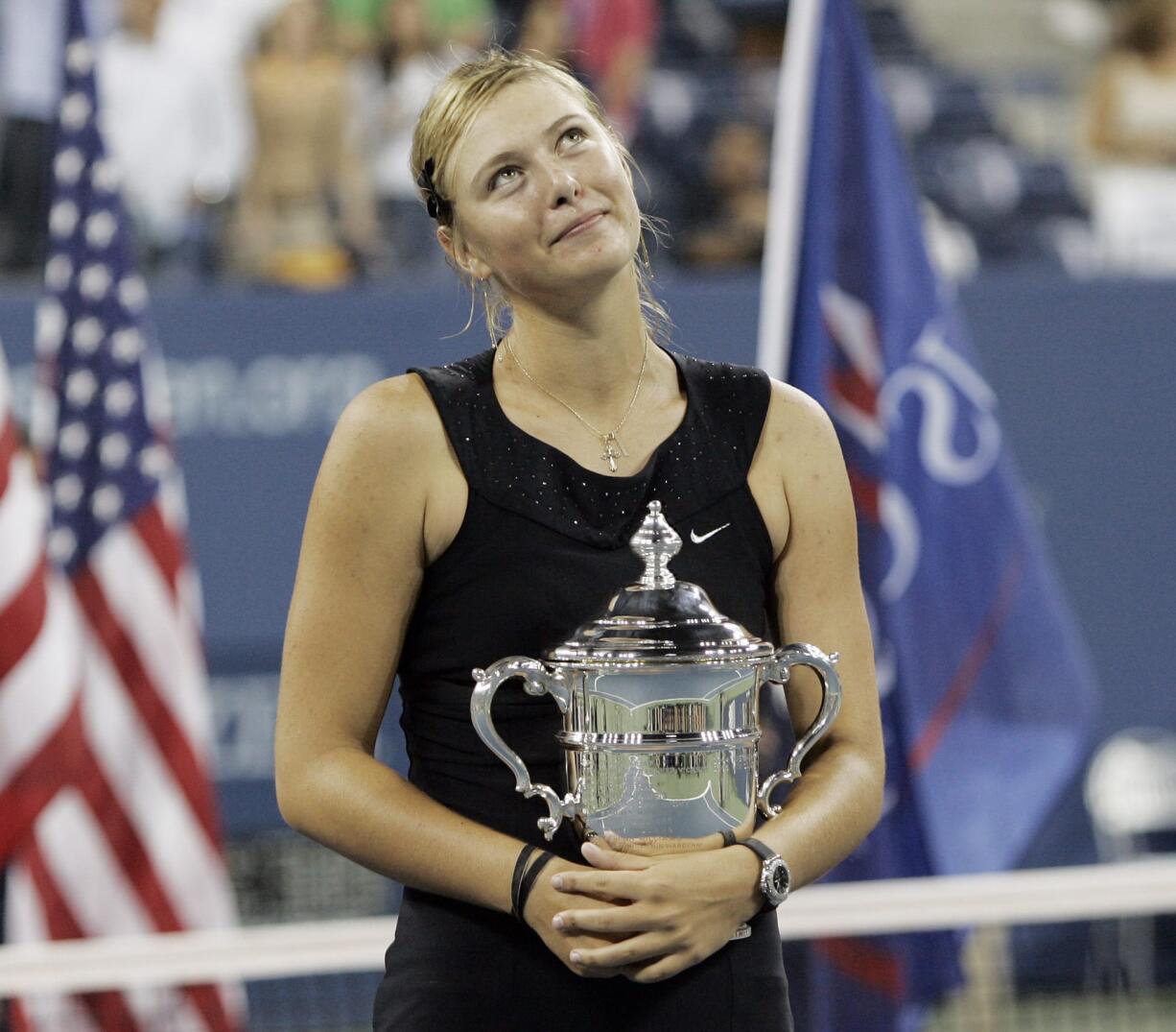 Maria Sharapova looks up to the crowd after winning the 2006 U.S. Open women's singles championship. Sharapova is retiring from professional tennis at the age of 32 after five Grand Slam titles. She has been dealing with shoulder problems for years.