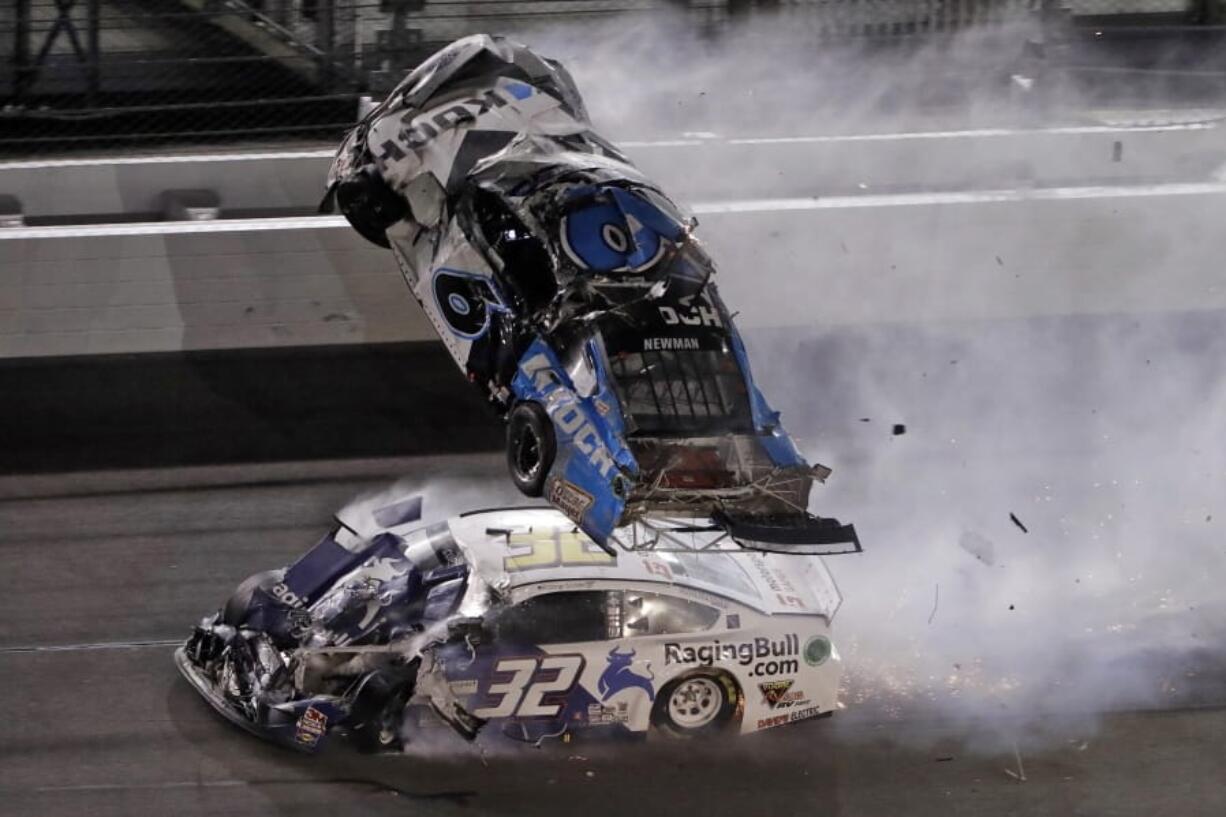 Ryan Newman (6) goes airborne after crashing with Corey LaJoie (32) during the NASCAR Daytona 500 auto race Monday, Feb. 17, 2020, at Daytona International Speedway in Daytona Beach, Fla.