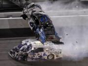 Ryan Newman (6) goes airborne after crashing with Corey LaJoie (32) during the NASCAR Daytona 500 auto race Monday, Feb. 17, 2020, at Daytona International Speedway in Daytona Beach, Fla.