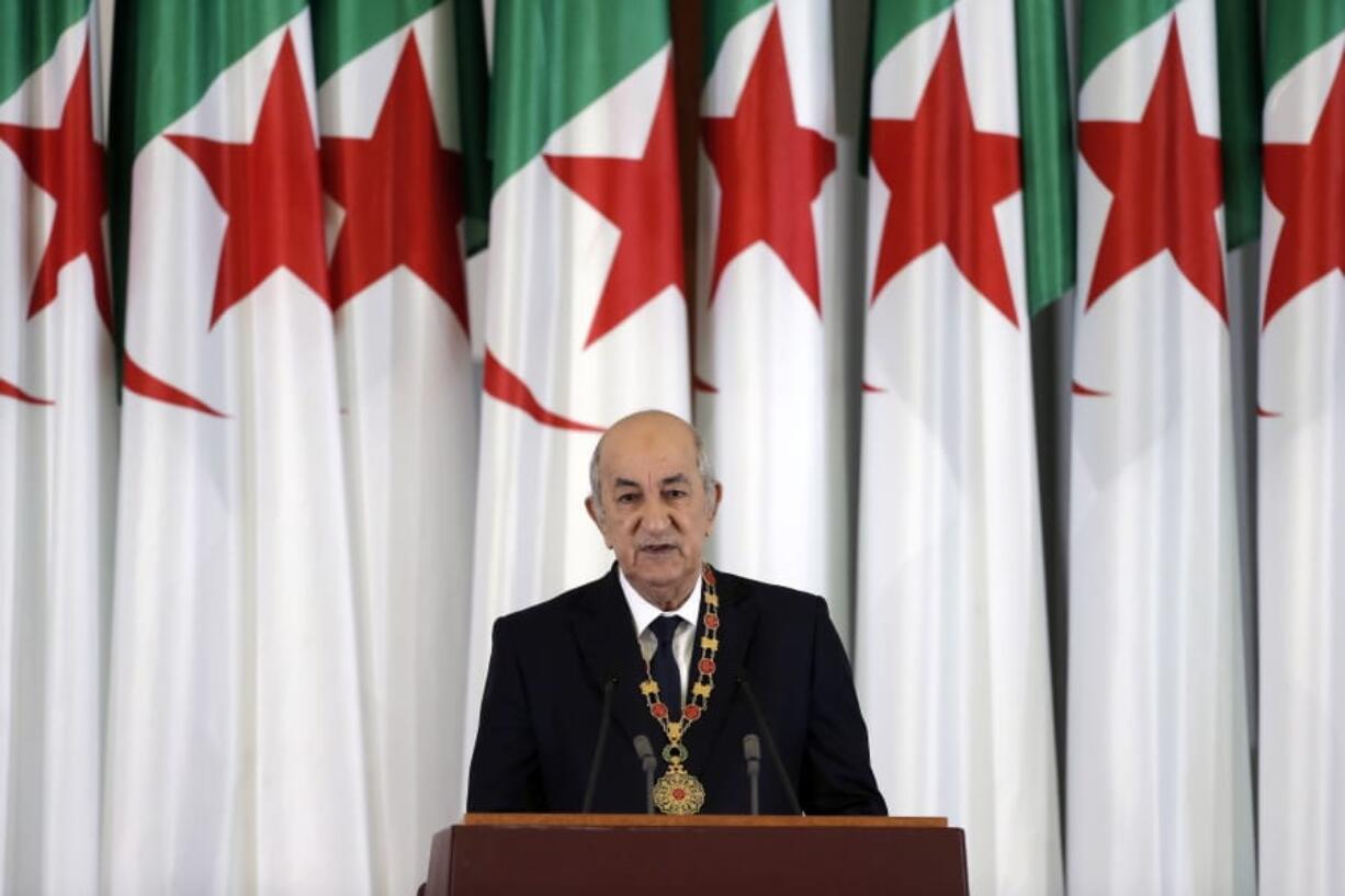 FILE- In this file photo dated Thursday, Dec. 19, 2019, Algerian president Abdelmadjid Tebboune delivers a speech during an inauguration ceremony in the presidential palace, in Algiers, Algeria.