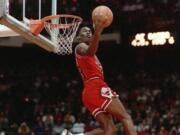 Chicago Bulls&#039; Michael Jordan dunks during the 1988 slam-dunk competition of the NBA All-Star weekend in Chicago. Jordan left the old Chicago Stadium that night with the trophy. To this day, many believe Wilkins was the rightful winner.