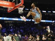 Miami Heat&#039;s Derrick Jones Jr. competes in the NBA All-Star slam dunk contest in Chicago, Saturday, Feb. 15, 2020. (AP Photo/Nam Y.