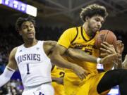 Washington forward Nate Roberts (1) reaches for the ball against Arizona State forward Taeshon Cherry (35) on a rebound during an NCAA college basketball game Saturday, Feb. 1, 2020, in Seattle.