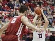 Arizona forward Stone Gettings (13) shoots near Washington State center Volodymyr Markovetskyy (15) during the second half of an NCAA college basketball game in Pullman, Wash., Saturday, Feb. 1, 2020. Arizona won 66-49.