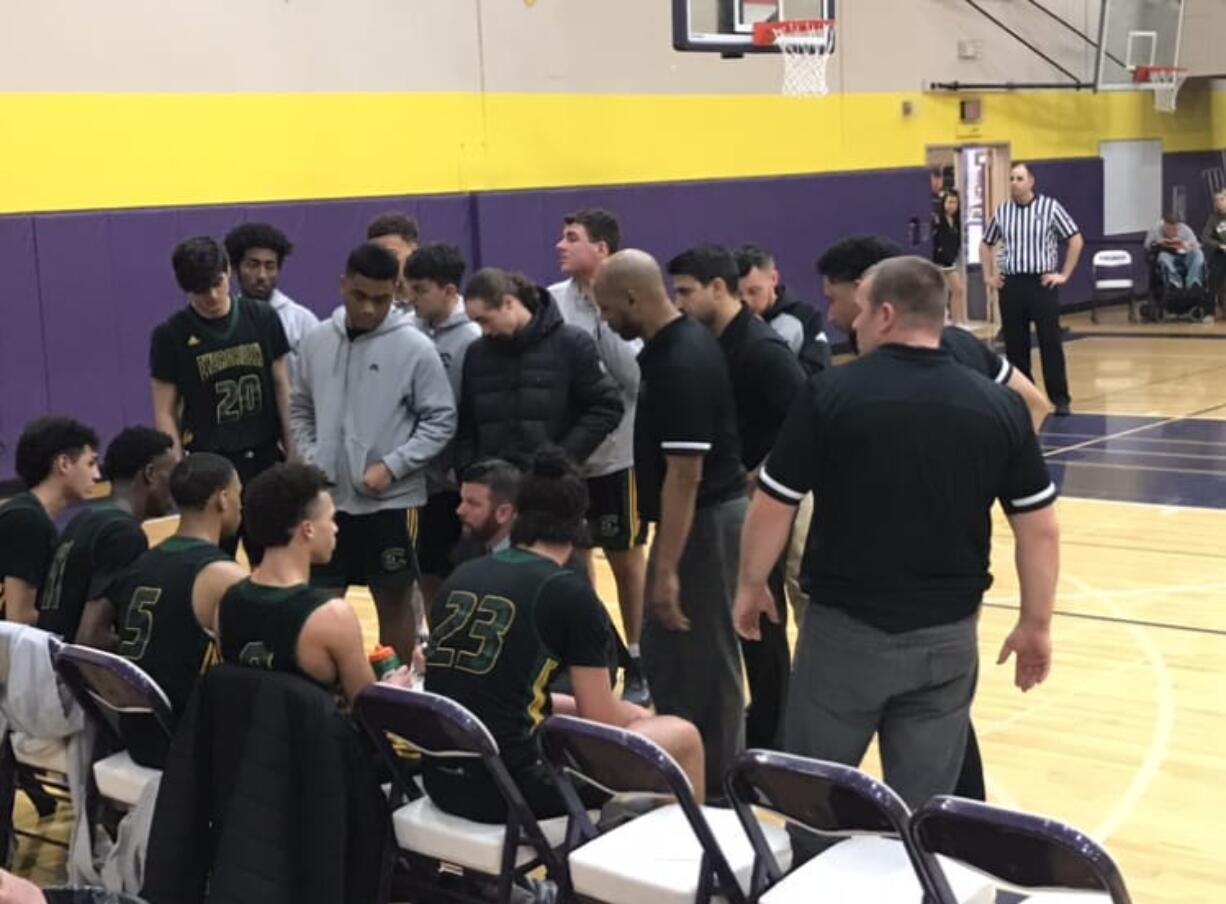 Head coach Brett He RT talks to his Evergreen Plainsmen during Saturday’s 3A bidistrict title game.