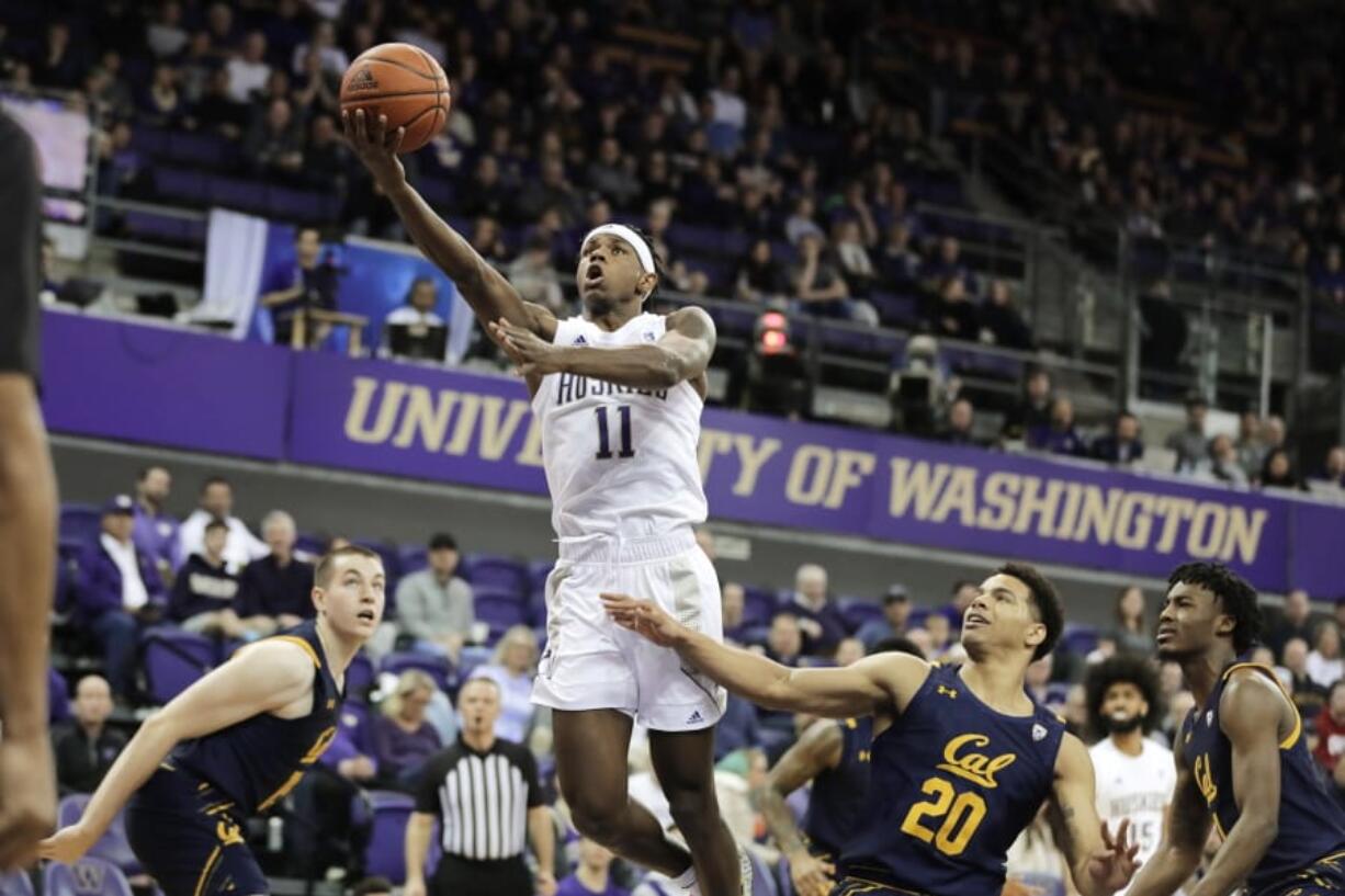 Washington guard Nahziah Carter (11) shoots above California guard Matt Bradley (20) during the first half of an NCAA college basketball game Saturday, Feb. 22, 2020, in Seattle. (AP Photo/Ted S.