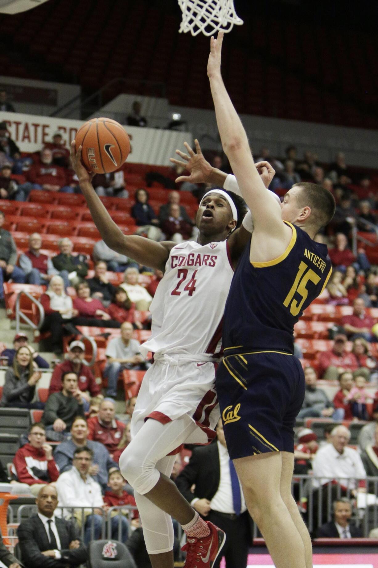 Washington State guard Noah Williams (24) is fouled by California forward Grant Anticevich (15) on a drive to the basket during the first half of an NCAA college basketball game in Pullman, Wash., Wednesday, Feb. 19, 2020.