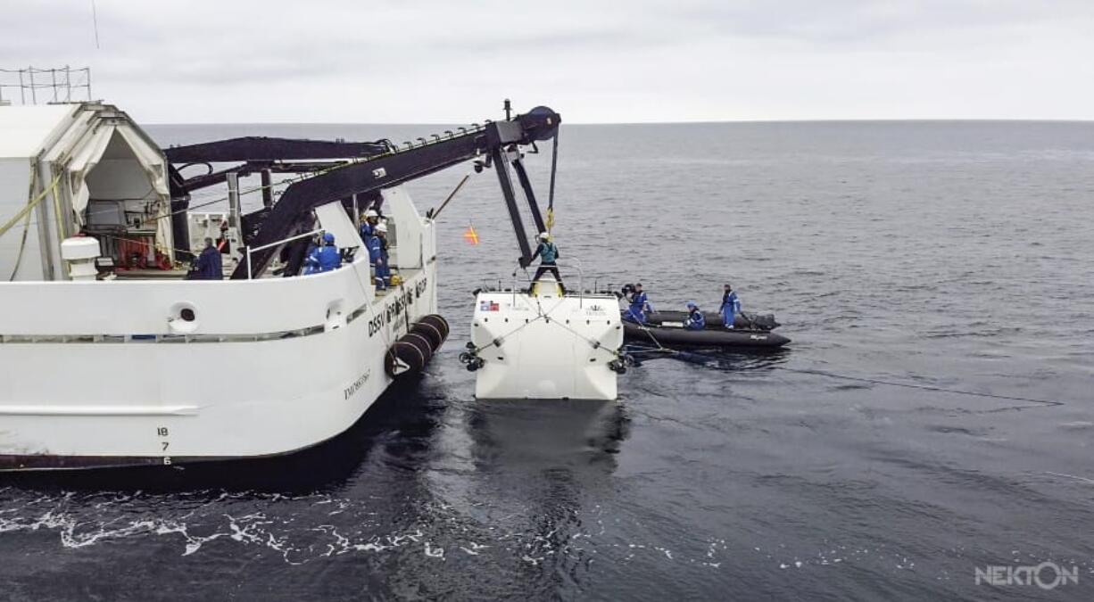 In this handout photo taken in Jan. 2020 and provided by Nekton, scientists lower the &quot;Limiting Factor&quot; submarine into the Mediterranean Sea, part of sea trials before the next stage of the Nekton Mission begins in mid-March. A team of scientists is preparing to dive deep into the depths of the Indian Ocean - into a &quot;Midnight Zone&quot; where light barely reaches, but life still thrives. Scientists from the British-led Nekton Mission plan to survey wildlife and gauge the effects of climate change in the unexplored area.