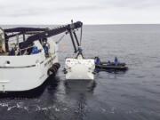 In this handout photo taken in Jan. 2020 and provided by Nekton, scientists lower the &quot;Limiting Factor&quot; submarine into the Mediterranean Sea, part of sea trials before the next stage of the Nekton Mission begins in mid-March. A team of scientists is preparing to dive deep into the depths of the Indian Ocean - into a &quot;Midnight Zone&quot; where light barely reaches, but life still thrives. Scientists from the British-led Nekton Mission plan to survey wildlife and gauge the effects of climate change in the unexplored area.