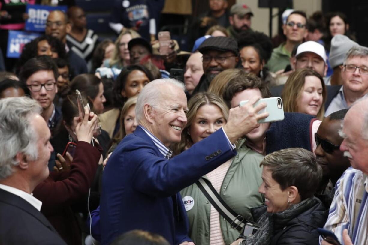 Democratic presidential candidate former Vice President Joe Biden takes photos with supporters at a campaign event at Saint Augustine&#039;s University in Raleigh, N.C., Saturday, Feb. 29, 2020.