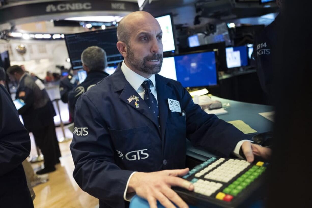 Stock traders work at the New York Stock Exchange, Wednesday, Feb. 26, 2020.