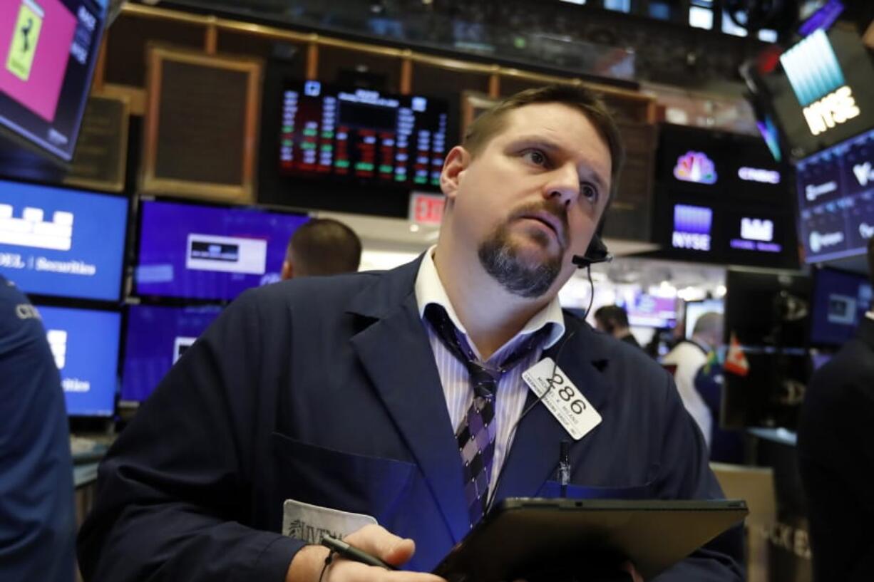 FILE - In this Feb. 24, 2020, file photo trader Michael Milano works on the floor of the New York Stock Exchange. The U.S. stock market opens at 9:30 a.m. EST on Thursday, Feb. 27.