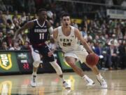 San Francisco guard Jordan Ratinho (25) drives against Gonzaga guard Joel Ayayi (11) during the first half of an NCAA college basketball game in San Francisco, Saturday, Feb. 1, 2020.