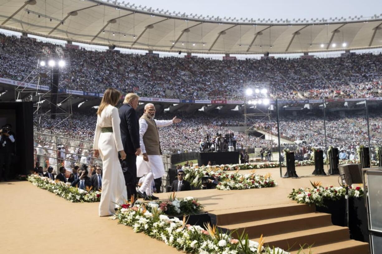 U.S. President Donald Trump, first lady Melania Trump, and Indian Prime Minister Narendra Modi arrive for a &quot;Namaste Trump,&quot; event at Sardar Patel Stadium, Monday, Feb. 24, 2020, in Ahmedabad, India. After Air Force One touched down in Ahmedabad in western India, Trump&#039;s motorcade slowly drove down streets lined with hundreds of thousands of onlookers. He began that day&#039;s high-wattage trio of presidential photo-ops: a visit to a former home of independence leader Mohandas Gandhi, a rally at a huge cricket stadium and a trip to the famed Taj Mahal.