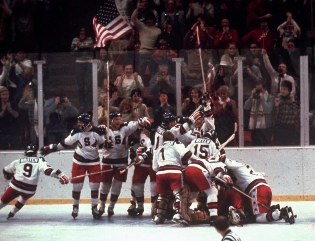 In this Feb. 22, 1980, file photo, the U.S. hockey team pounces on goalie Jim Craig after a 4-3 victory against the Soviet Union in a medal round match at the the 1980 Winter Olympics in Lake Placid, N.Y. The United States upset the mighty Soviets in a breathtaking moment freighted with the tension of the Cold War. After four decades, nobody is willing to stop talking about perhaps the greatest David over Goliath moment in the history of sports.