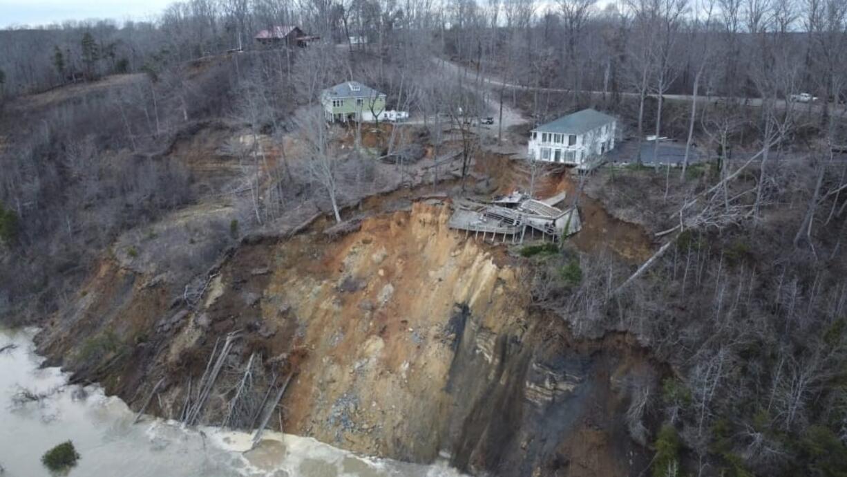 This drone photo provided by Hardin County Fire Department, Savannah, Tenn. on Feb. 15, 2030, shows the landslide on Chalk bluff on the Tennessee River.  Authorities say two homes were destroyed when a hillside collapsed near a swollen river in western Tennessee. News outlets report no one was injured in the slide, which occurred along the Tennessee River near the Hardin County community of Savannah.(Melvin Martin /Hardin County Fire Department, Savannah, Tenn.