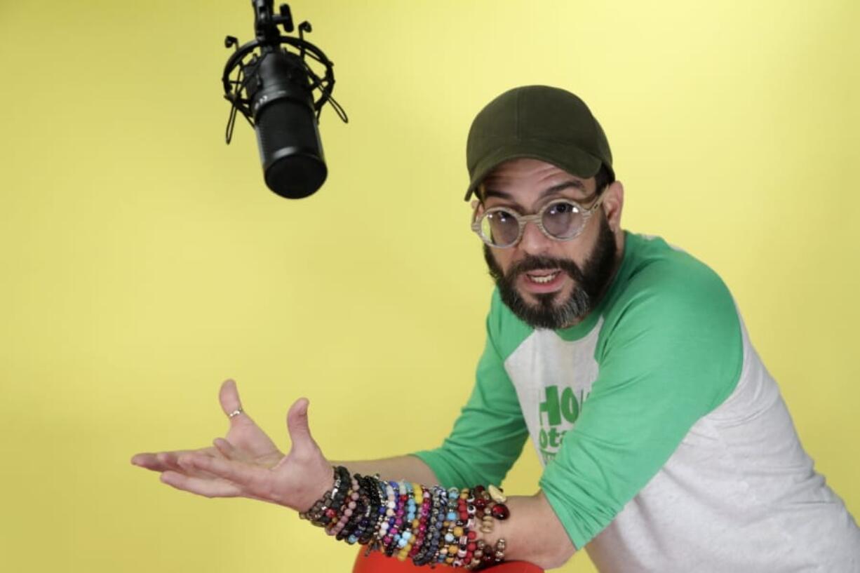 In this Thursday, Jan. 16, 2020 photo, Alex Otaola speaks during an interview in Miami. Otaola, a 40-year-old Cuban-born YouTube personality who has organized boycotts of Cuban figures like Gente de Zona and singer Haila Mompie that have led to de facto bans on their performing in South Florida.