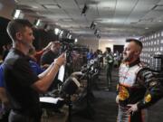 Austin Dillon, right, takes part in an interview during NASCAR Daytona 500 auto racing media day at Daytona International Speedway, Wednesday, Feb. 12, 2020, in Daytona Beach, Fla.