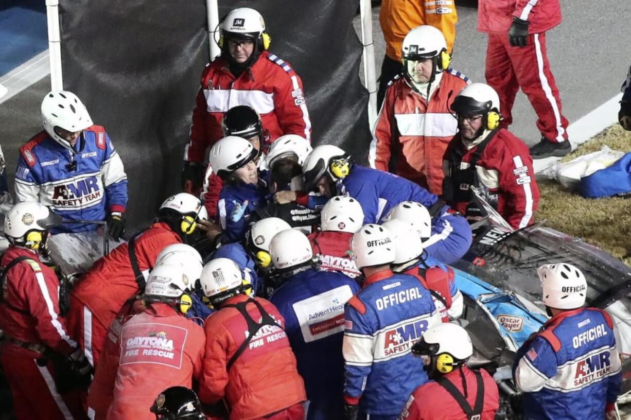 Ryan Newman is removed from his race car after crashing during the NASCAR Daytona 500 auto race at Daytona International Speedway, Monday, Feb. 17, 2020, in Daytona Beach, Fla.