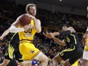 Arizona State&#039;s Mickey Mitchell (00) wins a loose ball against Oregon&#039;s Chandler Lawson (13) during the first half of an NCAA college basketball game Thursday, Feb. 20, 2020, in Tempe, Ariz.