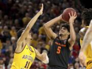 Oregon State&#039;s Ethan Thompson (5) looks to the basket against Arizona State&#039;s Alonzo Verge (11) during the first half of an NCAA college basketball game Saturday, Feb. 22, 2020, in Tempe, Ariz.