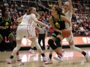 Oregon&#039;s Sabrina Ionescu (20) looks to shoot between Stanford&#039;s Ashten Prechtel (11) and Lexie Hull, right, in the first half of an NCAA college basketball game Monday, Feb. 24, 2020, in Stanford, Calif.