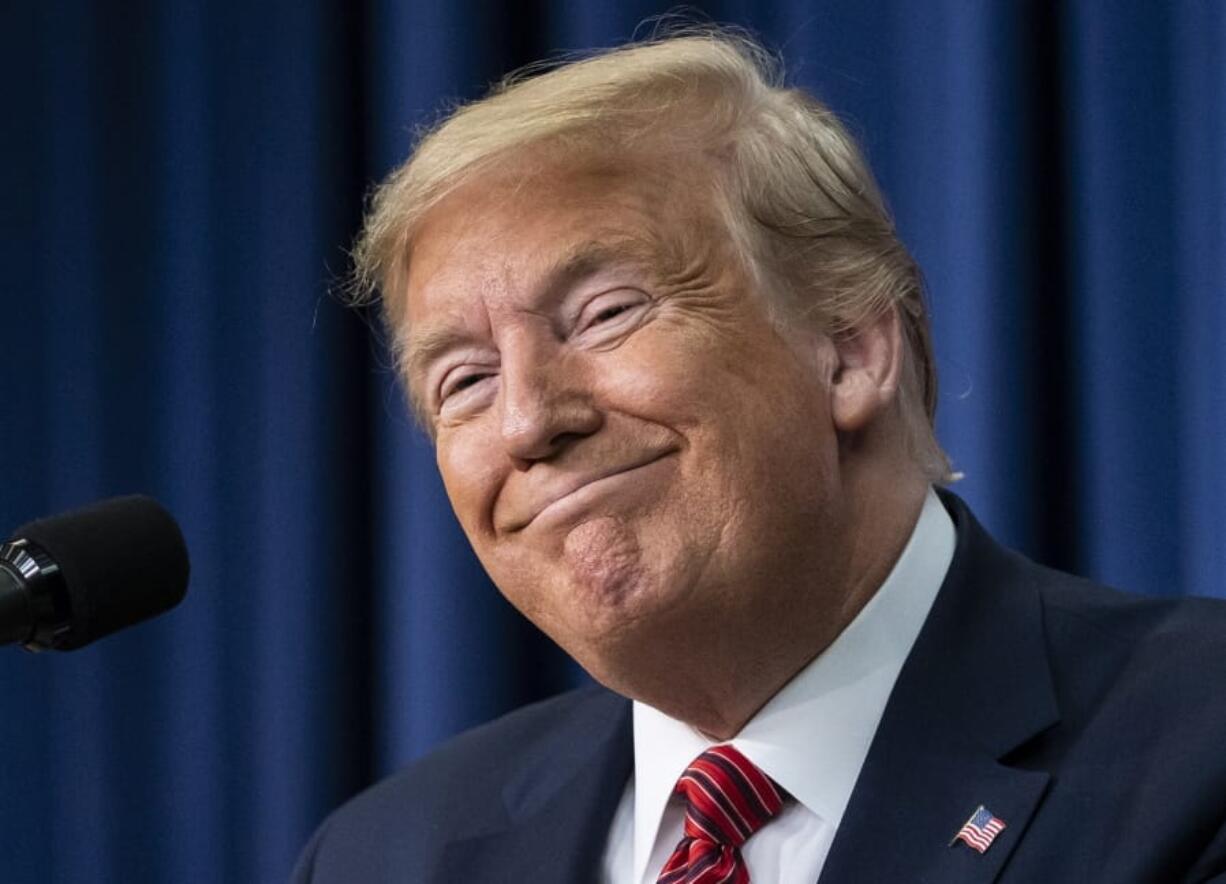 President Donald Trump smiles as he speaks to members of the National Border Patrol Council at the White House in Washington, Friday, Feb. 14, 2020. (AP Photo/J.