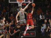 Oregon State&#039;s Kylor Kelley (24) blocks a shot by Utah&#039;s Timmy Allen (1) during the first half of an NCAA college basketball game in Corvallis, Ore., Thursday, Feb. 13, 2020.