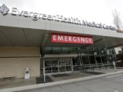 EvergreenHealth Medical Center is seen Saturday, Feb. 29, 2020, where a person died of COVID-19, in Kirkland, Wash. State health officials announced the death Saturday, marking the first such reported death in the United States. State officials issued a terse news release announcing the death, and gave no details before a scheduled news conference later in the day.